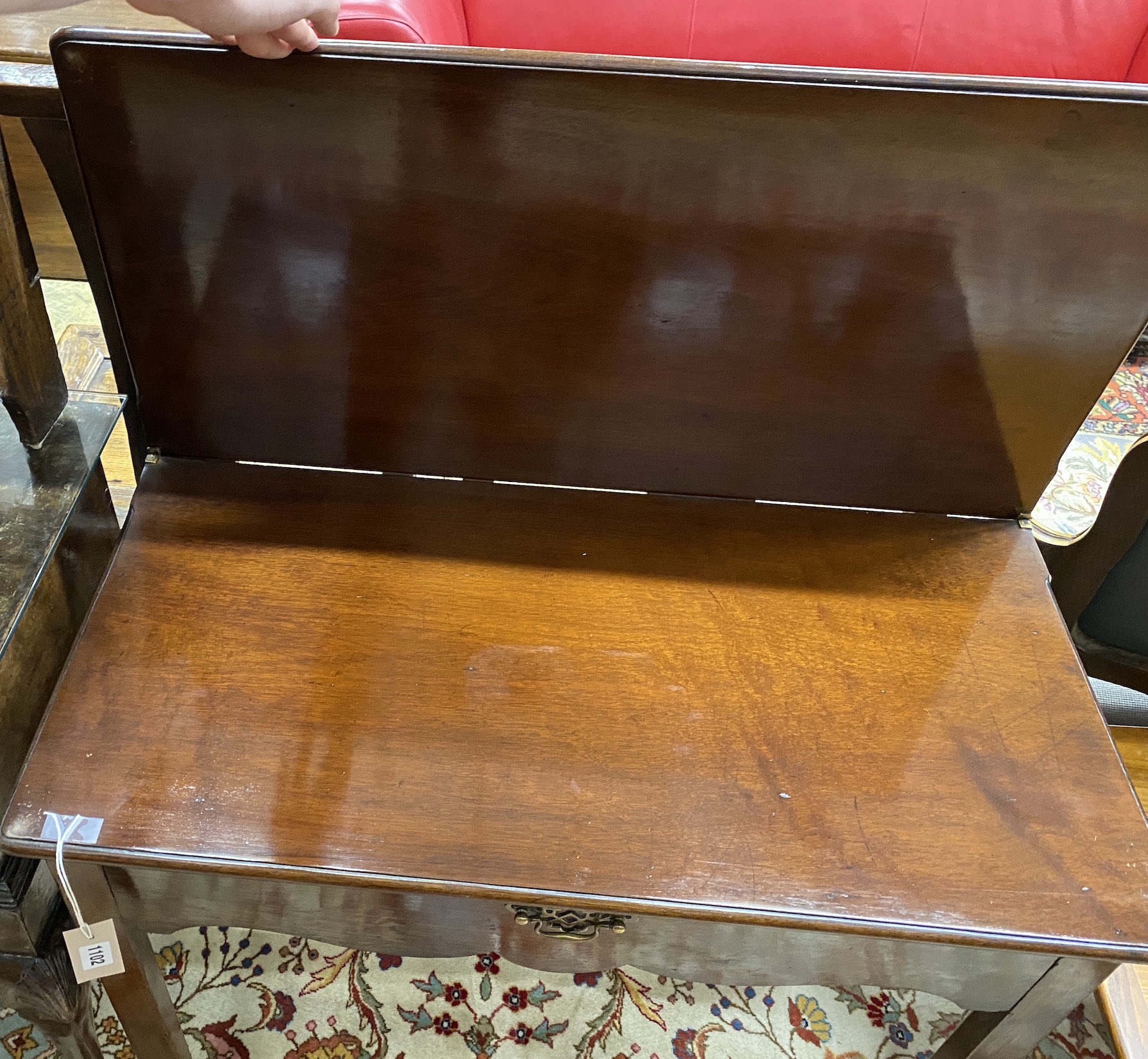 A George III rectangular mahogany folding tea table, width 80cm, depth 40cm, height 74cm